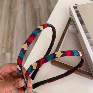 Pair of colorful heart pattern fabric headbands for women with sweet Korean style design
