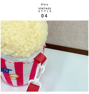 Detail of soft popcorn plush bag showing lamb wool texture and red striped patterns