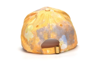 Detailed back view of children's baseball cap with adjustable metal buckle and floral pattern