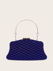 Detail of dark blue velvet evening clutch with rhinestone lattice and gold metal handle