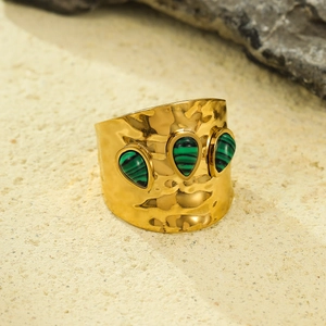 French vintage wide textured gold ring with green natural stones on beige stone base