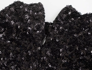 Close-up of black sequin dress detail featuring a high-quality hidden zipper closure