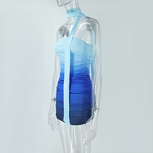Detail of blue gradient bodycon dress featuring ruched fabric and a chic halter neck tie