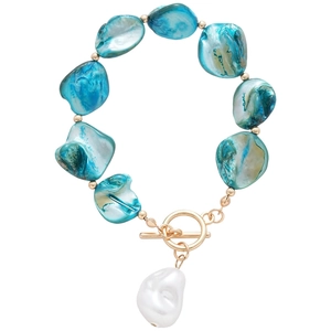 Irregular blue shell bead bracelet with white pearl pendant and gold toggle clasp