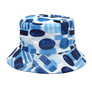 Detail of blue and white abstract print bucket hat showing dense multi-row stitching on brim