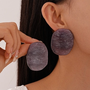 Irregular candy-colored acrylic drop earrings in deep purple with horizontal textures