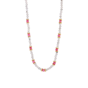 Macro detail of handmade beaded necklace with pink faceted beads and gold spacers
