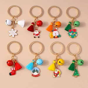 Detail view of 8-piece Christmas keychains with bells, colorful tassels and festive charms