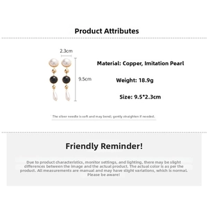 Detail showing 9.5x2.3cm gold plated pearl drop earrings with copper and silver needles