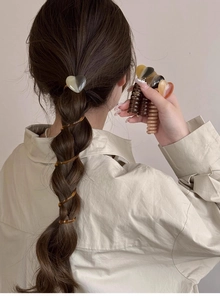 Close-up of heart hair clips and spiral hair ties for bubble braids styling
