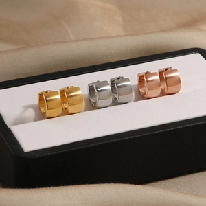 Minimalist brushed titanium steel hoop earrings in gold, silver, and rose gold finishes