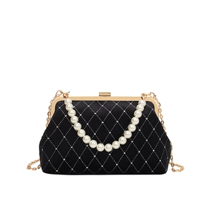 Elegant black velvet evening clutch with diamond lattice, pearl handle, and gold chain