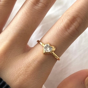 Minimalist 925 sterling silver heart-shaped zircon ring worn on a finger