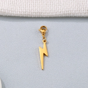 Golden lightning bolt pendant with lobster clasp for DIY jewelry making on grey surface