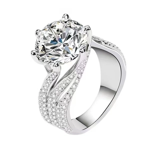 Luxury six-prong silver ring with a large brilliant-cut zircon and pavé diamond band