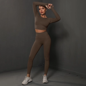 Detailed view of seamless high-waist yoga set with ribbed compression fabric and body contouring