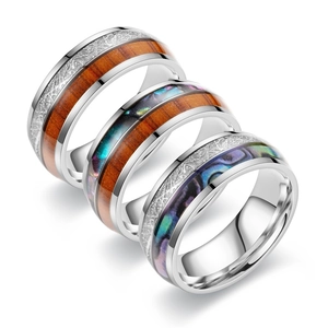 Set of three vintage titanium steel rings featuring wood grain and colorful abalone shell inlays
