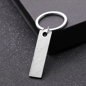 Silver stainless steel rectangular keychain with textured finish and standard key ring