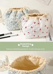 Quilted cosmetic bag with drawstring closure, portable travel makeup pouch storage.