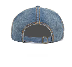 Rear view of washed denim cap with orange contrast stitching and adjustable metal buckle