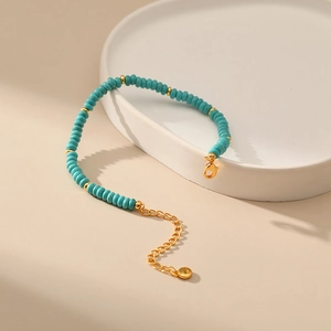 Handmade Bohemian turquoise beaded bracelet with gold plated spacers and extension chain