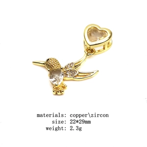 Golden copper hummingbird pendant with zircon stones and dimensions 22x29mm