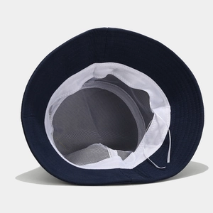 Dark blue bucket hat with breathable white mesh lining and adjustable chin strap