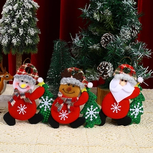 Detail of fabric Christmas ornaments featuring Santa, snowman, and reindeer with green trees
