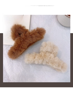 Close-up of fluffy faux fur hair claws in dark brown and cream white for autumn