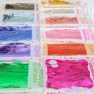 Detail of colorful foil fringe curtains in multiple metallic shades for party decor