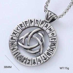 Macro detail of silver Viking Celtic knot pendant showing intricate Nordic runes and textures