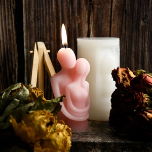 Artistic embrace couple scented candle in pink and white for home decor display