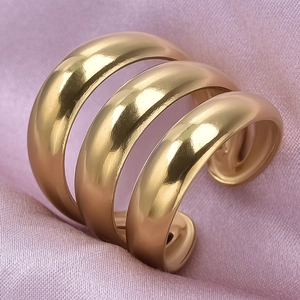 Polished 304 stainless steel chunky wide gold ring with layered wave design and silk background