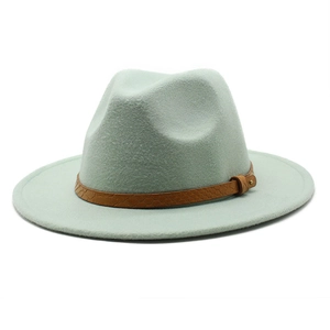 Detailed view of mint green fedora hat featuring a brown snakeskin pattern leather belt