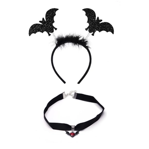 Detail of Halloween bat headband with sequins and a red heart choker on white background