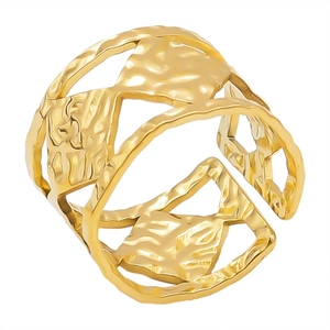 Adjustable golden stainless steel open ring with hollow geometric texture on white background