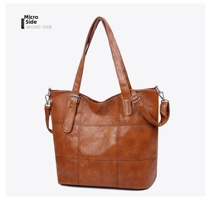 Micro side view of vintage brown leather tote bag with elegant square quilted pattern
