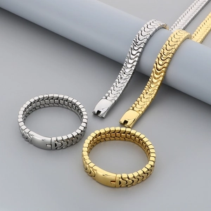 Close-up of gold and silver stainless steel dragon bone chain bracelets and necklaces