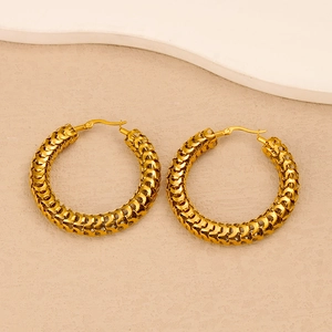 Close-up of 18K gold-plated stainless steel hoop earrings with woven texture detail