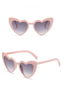 Front and side views of heart shaped pink sunglasses with gradient grey lenses