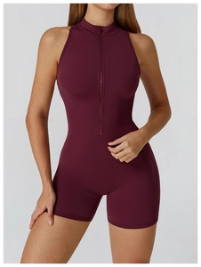 Detail of high-stretch burgundy sports romper featuring half-zipper stand collar design