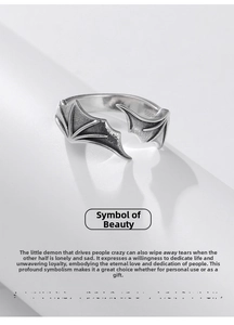 Detailed view of the 999 sterling silver devil wing ring with a vintage finish