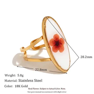 18K gold plated stainless steel ring featuring a real dried flower in an oval resin setting