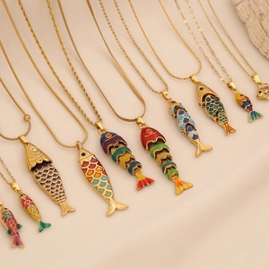 Colorful enamel fish pendant necklace in gold stainless steel with sparkling details