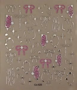 Macro view of 5D gel bowknot nail stickers with metallic stars and 3D relief texture