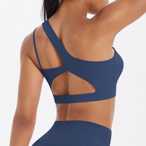 Detail of dark blue one-shoulder sports bra with criss-cross back and wide elastic band