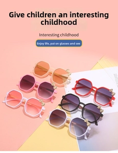 Flat lay of colorful polygon kids sunglasses with gold bow accents in six pastel shades