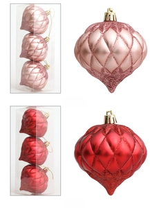 Detailed view of rose gold and red Christmas onion ornaments with glittery embossed textures