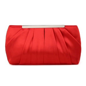 Detail of red pleated satin evening clutch bag with silver metal frame and clasp closure