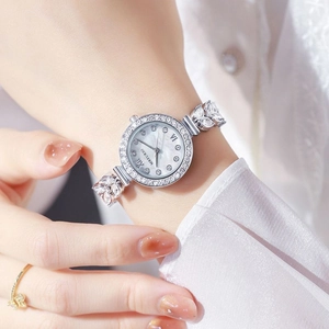 Women's quartz watch with diamond bezel and mermaid-style silver metal chain strap